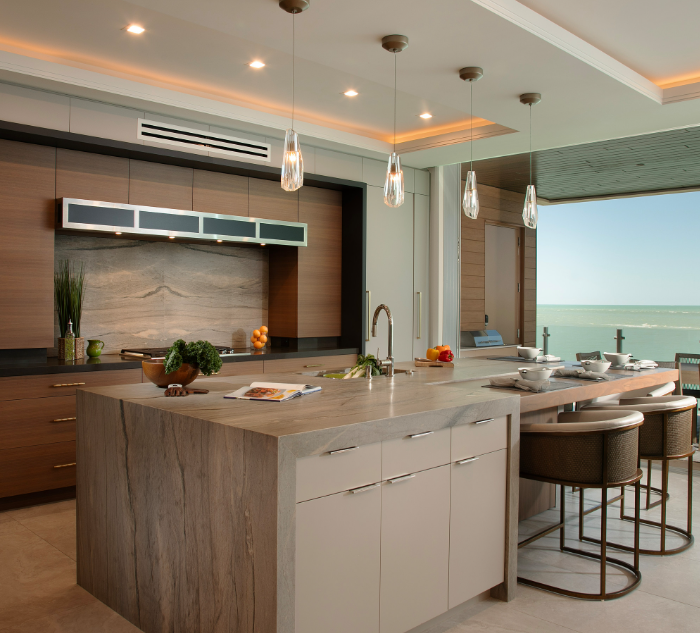 Custom kitchen cabinets Sarasota — Siesta Key Masterpiece featuring slab doors in Rift Sawn Walnut and La Paloma Gray with Gulf views by EuroTech Cabinetry